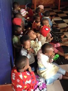 The children enjoy a snack of fruit, on this day a quarter of an orange and third of a banana.