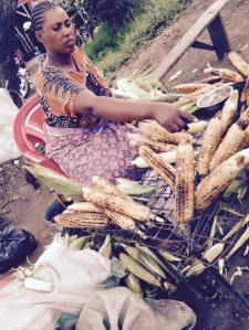 This vendor starts getting my corn, my daily lunch after leaving Save Africa, ready as soon as she sees me.