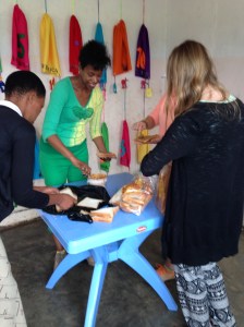 Before two other volunteers bought this table, we were making peanut butter sandwiches for the kids on the floor.