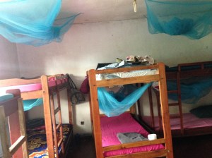 The girls bedroom, where the kids sleep three or more to a bed, some of them without sheets or pillows.