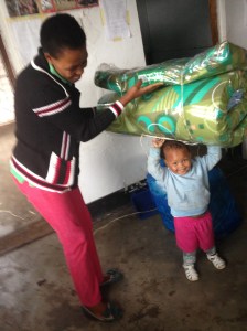 Angel shows off her strength, with the help of Teacher Mary.